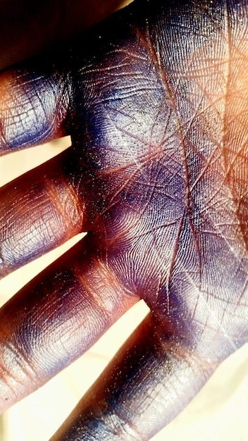 Close-up shot of a hand using an AI-powered prosthetic, highlighting the intricate design and seamless integration with the user's body. The focus is on the advanced sensor technology and precise movements that allow for natural and intuitive control.