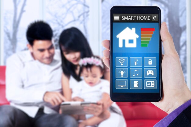 A split image showing a family receiving a smart home device (e.g., thermostat) on one side, and a graph indicating a reduction in their energy bill on the other.