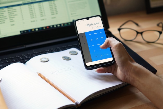 A close-up image of a smartphone screen displaying a budgeting app. The app shows a detailed breakdown of expenses, with a prominent category highlighting savings achieved through the use of discount gift cards.