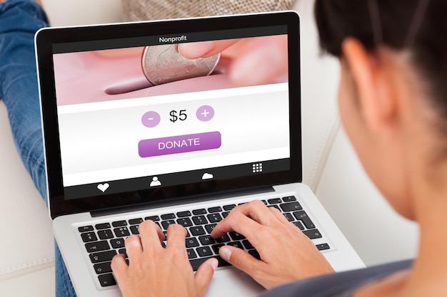 A close-up of a laptop screen displaying a retailer's website with a pop-up encouraging email sign-up for a discount.