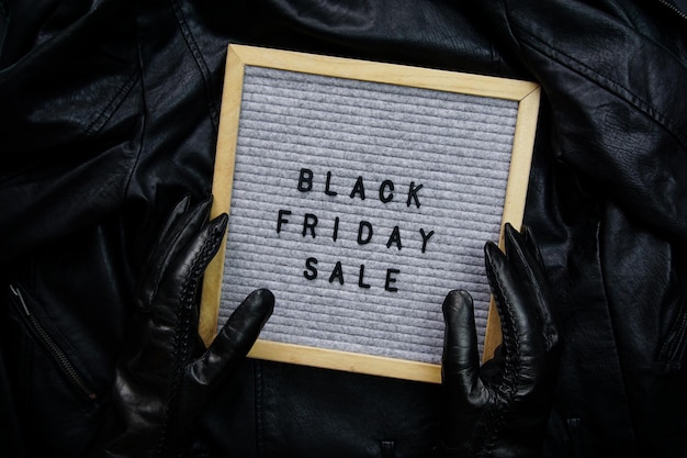 A close-up shot of sale signs displaying percentage discounts, capturing the essence of bargain hunting during Black Friday and Cyber Monday.