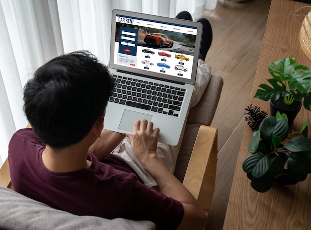 A person using a laptop with multiple browser tabs open, each displaying a different discount shopping website. The focus is on the screen, showing the variety of deals.