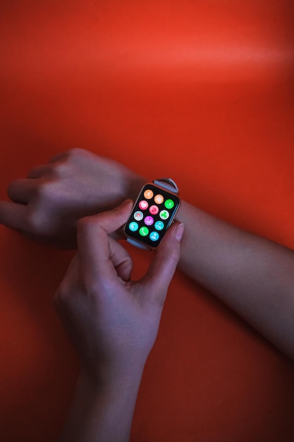 A close-up shot of a smartwatch displaying numerous notifications from various apps, depicting the feeling of overwhelm and constant interruption.