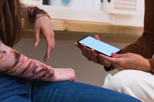 A close-up of a smartphone screen displaying a conversation with an AI therapy bot, showing a supportive message and interactive options for the user.