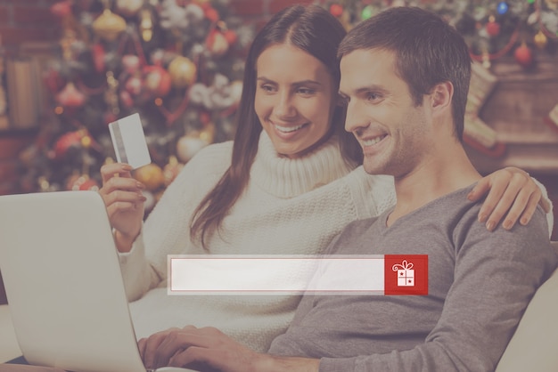 A split-screen image: on one side, a person happily browsing a gift card marketplace on their laptop; on the other side, a close-up of discounted gift cards displayed on the screen. The overall tone is positive and savings-oriented.