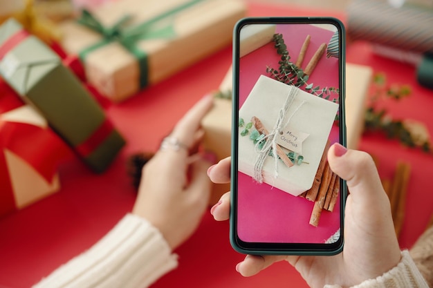 A close-up shot of a smartphone screen displaying a listing of discounted gift cards on an online marketplace, with various brands and discount percentages visible.
