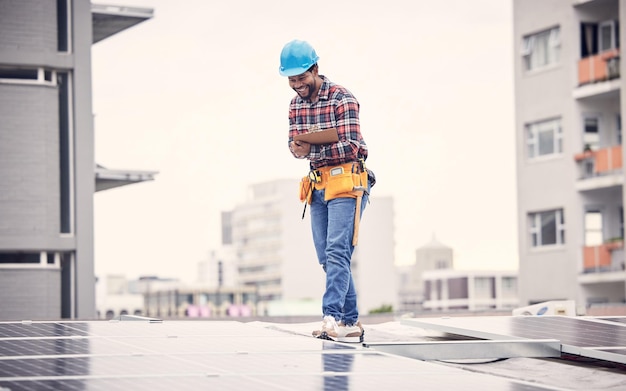 A medium shot of a solar panel installation on the rooftop of a modern building, surrounded by trees. The image conveys the integration of renewable energy technology into urban infrastructure, promoting sustainability.